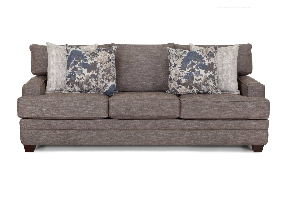 Gray fabric sofa with three seat cushions and two blue floral pillows