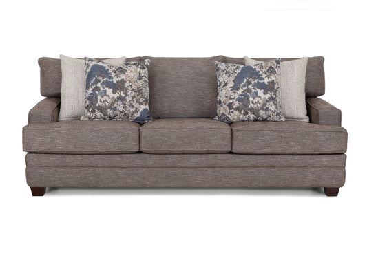 Gray fabric sofa with three seat cushions and two blue floral pillows