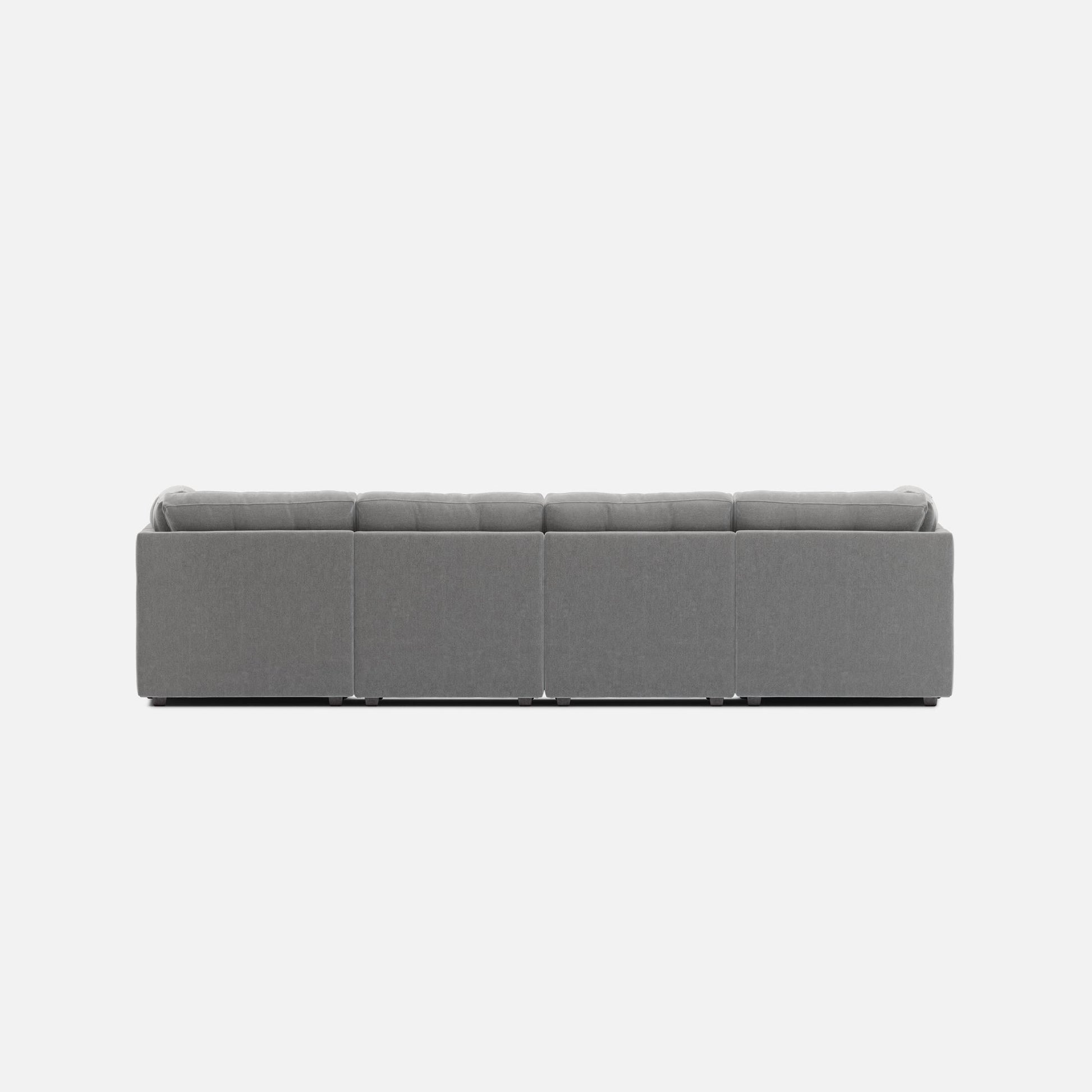 Light gray 6-piece modular sectional sofa with boxy armrests and tufted cushions