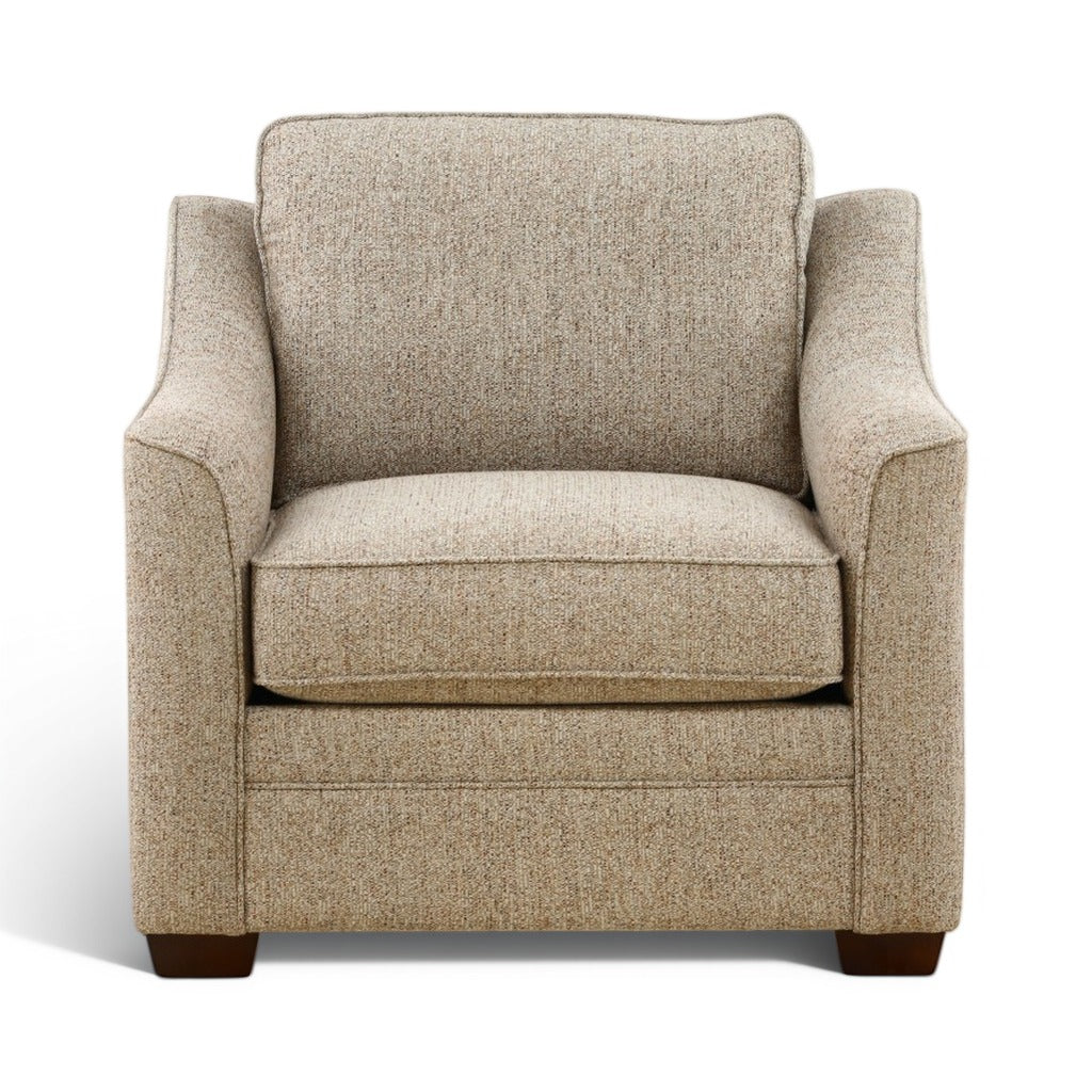 Light beige accent chair with tall backrest, cushioned arms, dark brown legs