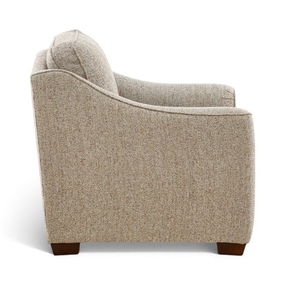 Light beige upholstered chair with deep seat, curved sides, dark brown legs