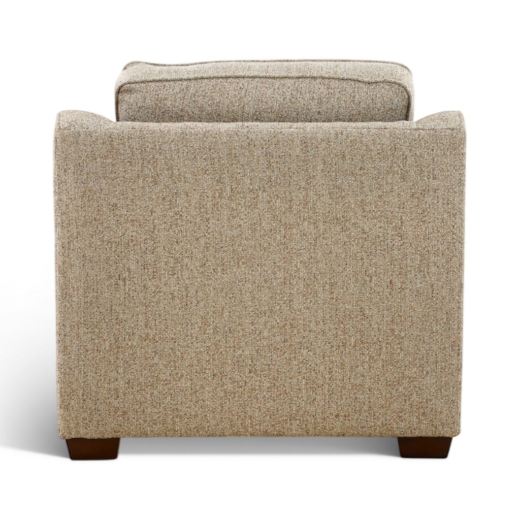 Light beige upholstered chair with high back and seat cushion, dark legs