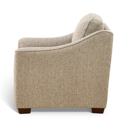 Light beige chair with curved back and arms, dark brown tapered legs