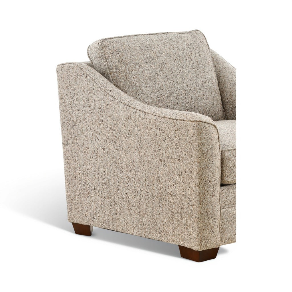 Light beige blend-down chair with rounded front arms and visible seam lines, dark legs