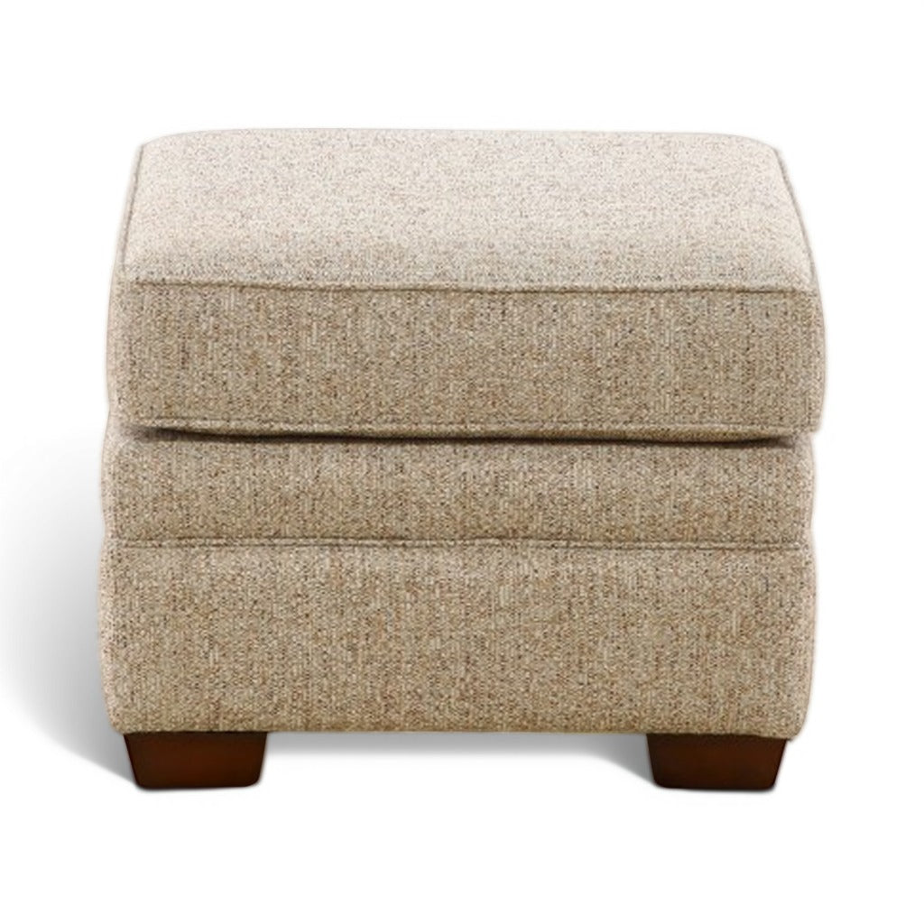 Beige upholstered ottoman with stitched panel detail and dark wood legs