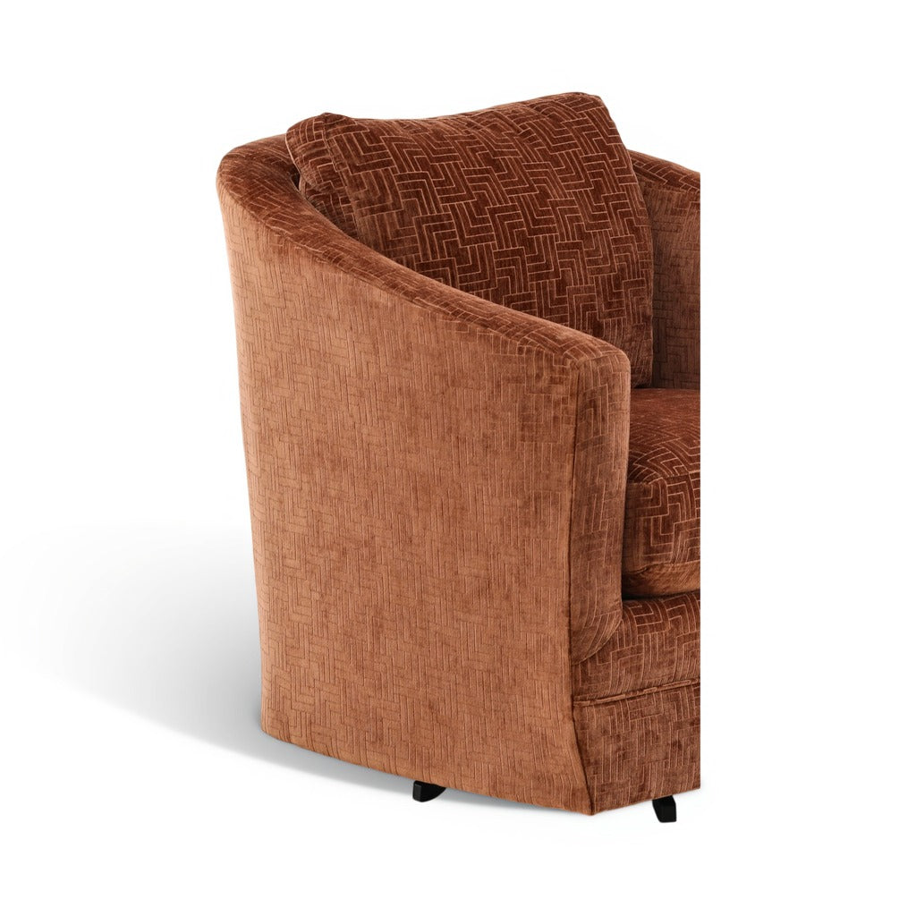 3/4 view of brown accent chair with patterned back cushion and angled arms