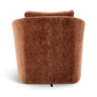 Back view of brown upholstered accent chair with curved arms and patterned headrest