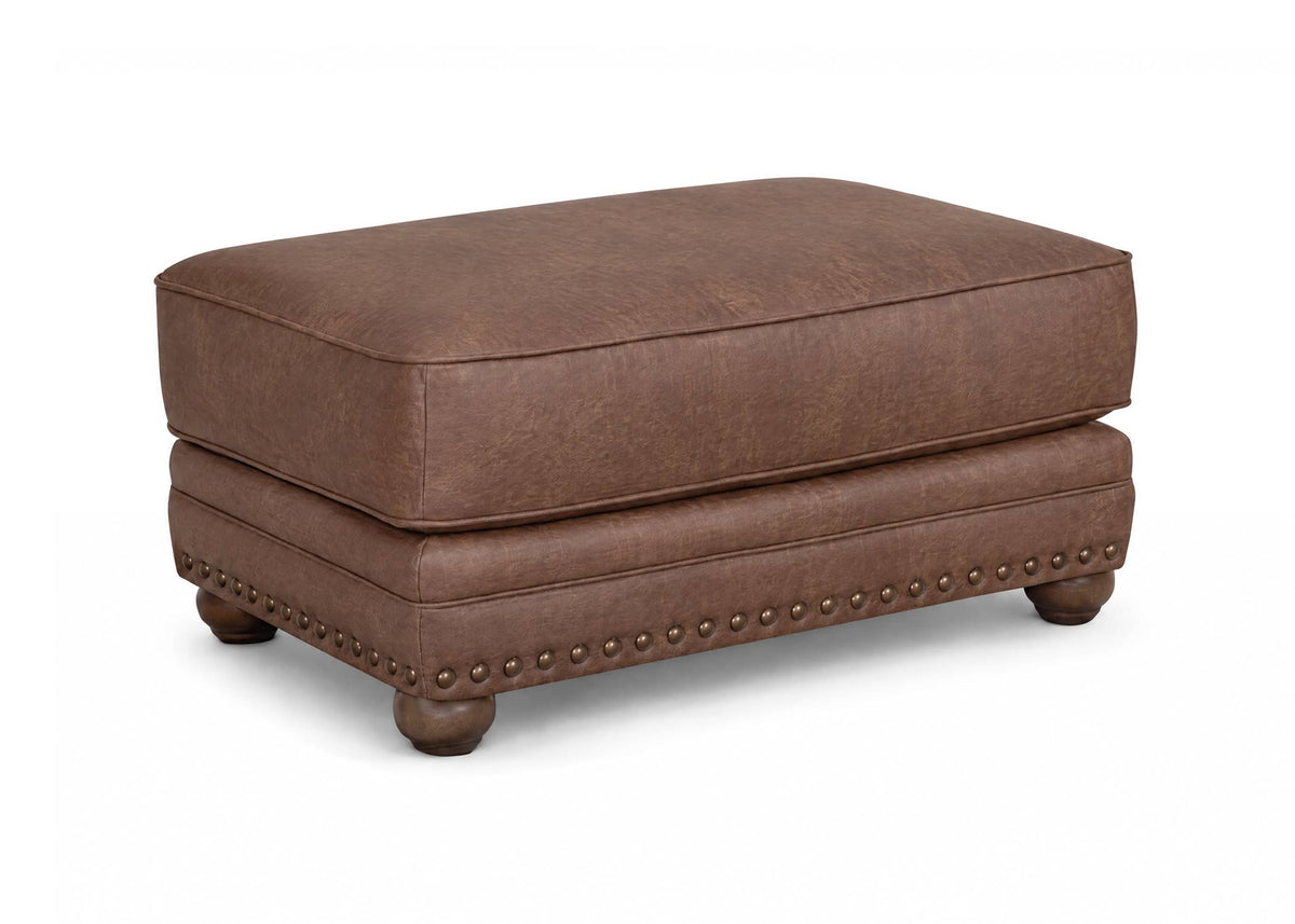 Dark brown ottoman with padded seat, studded side trim, and short wooden legs