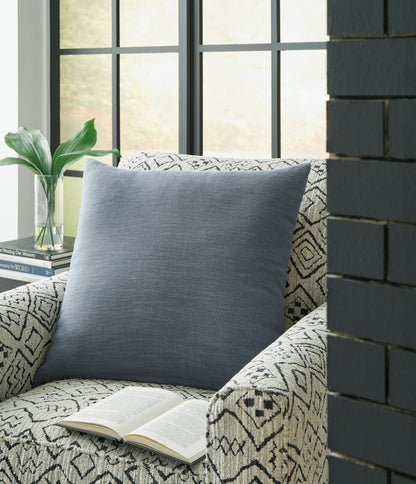 Blue square throw pillow with textured woven fabric, shown from a front angle