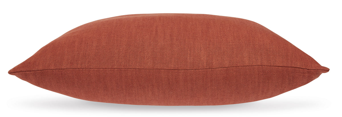 Rust fabric throw pillow with stitched edge seam