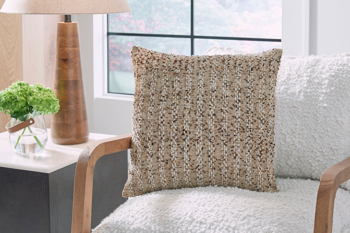 Beige textured decorative throw pillow with woven pattern, on-chair view