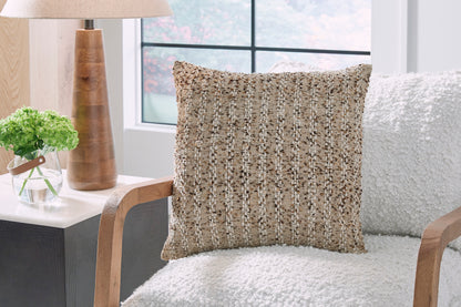 Beige textured decorative throw pillow with woven pattern, on-chair view