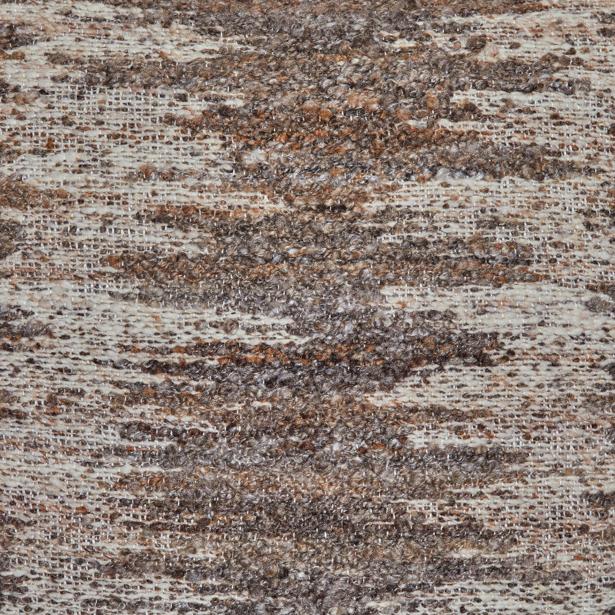 Close-up of brown, tan, and gray woven pillow fabric with flecked stripes
