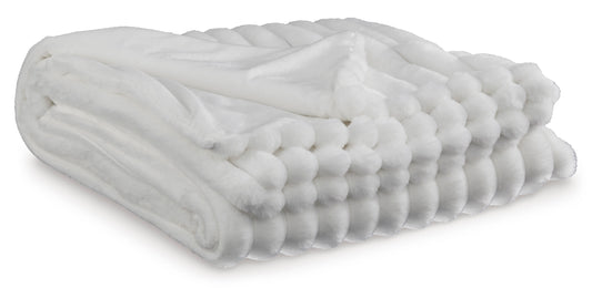 White folded plush throw blanket with rounded quilted ridges