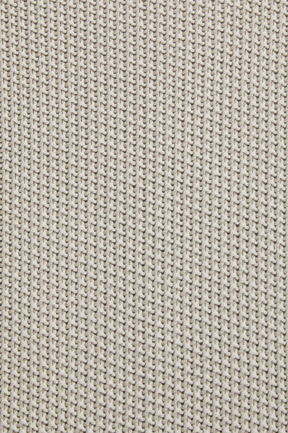 Sand knit throw blanket fabric close-up, textured vertical stitch pattern