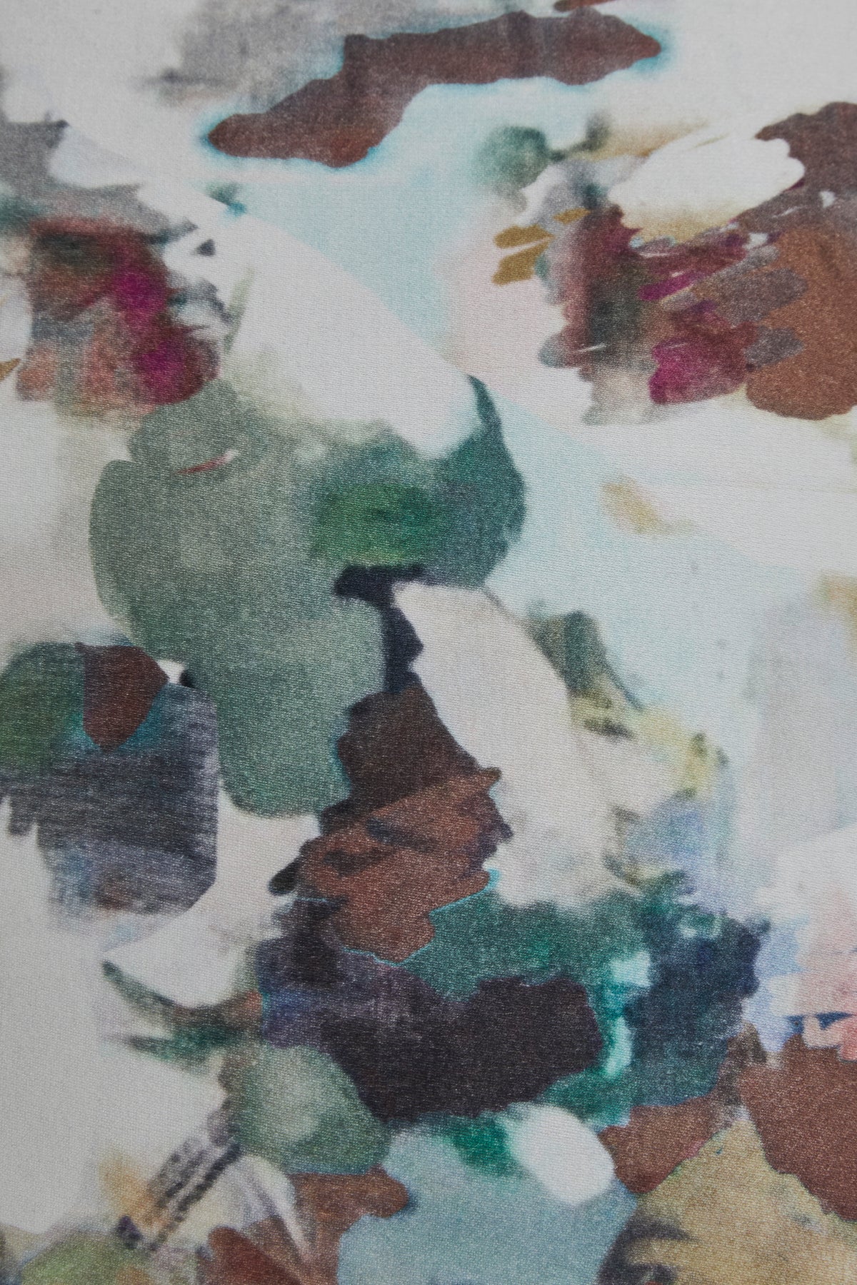 Close-up of multicolor abstract watercolor print pillow fabric