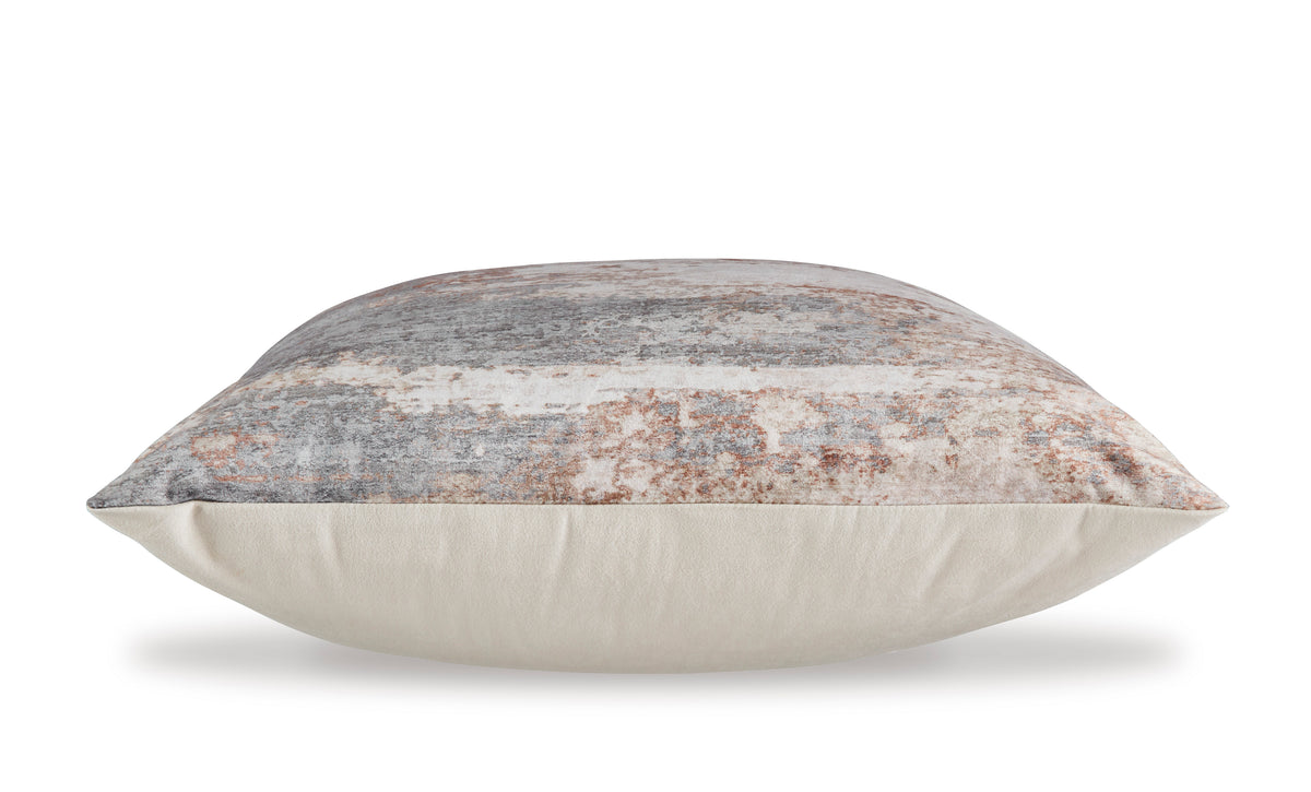 Square pillow shown from the side with distressed abstract print fabric