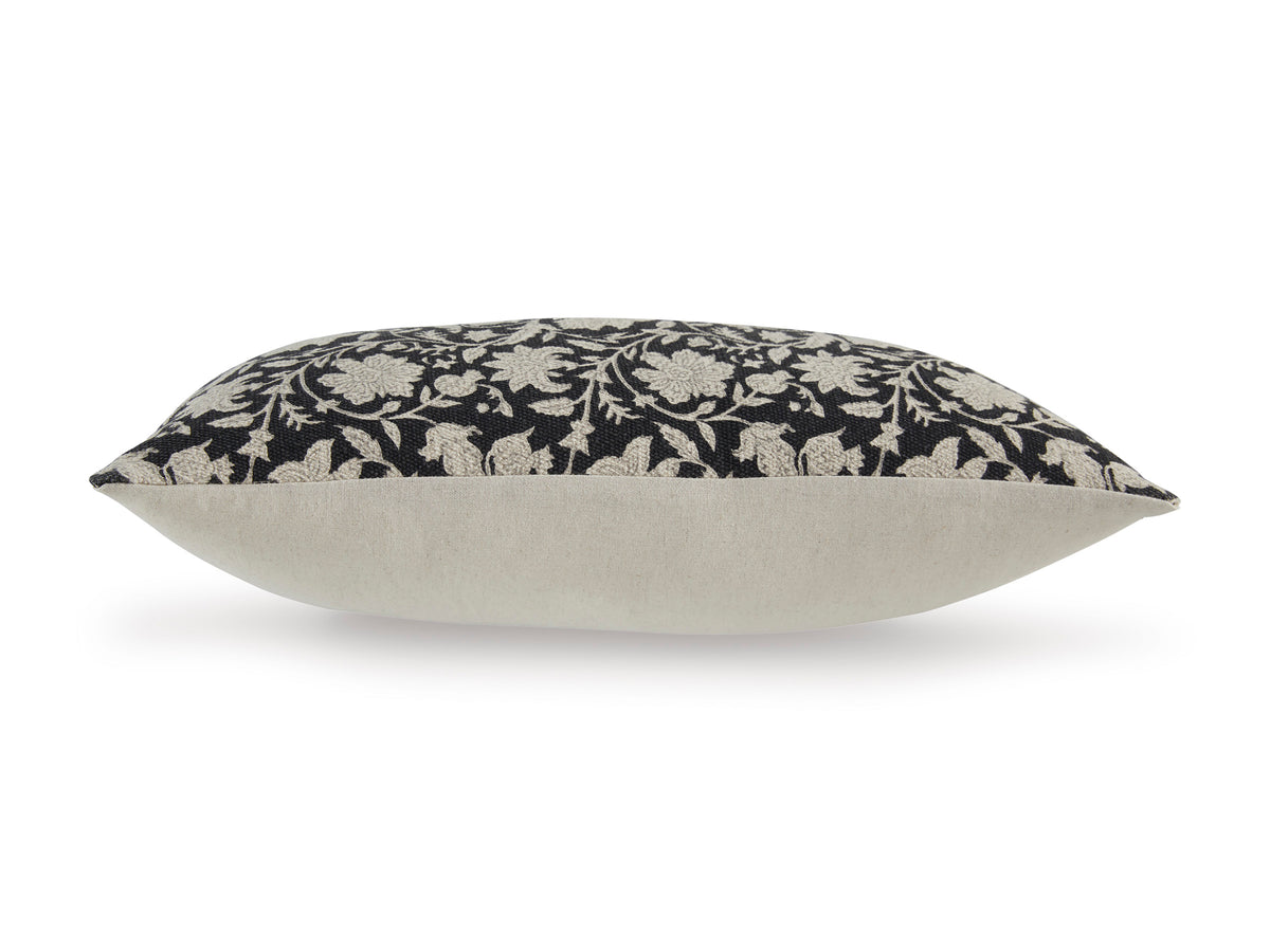 Back and edge view of black floral pillow with light gray border