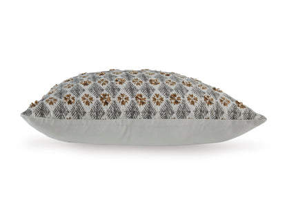 Light gray decorative pillow with brown floral pattern on top, piped edges