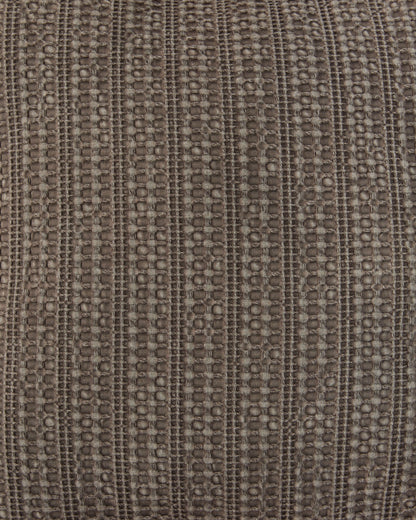 Close-up of taupe-brown textured woven fabric with repeating stitched pattern