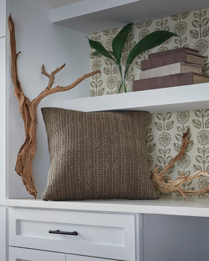 Textured decorative pillow with horizontal stitched pattern in taupe-brown