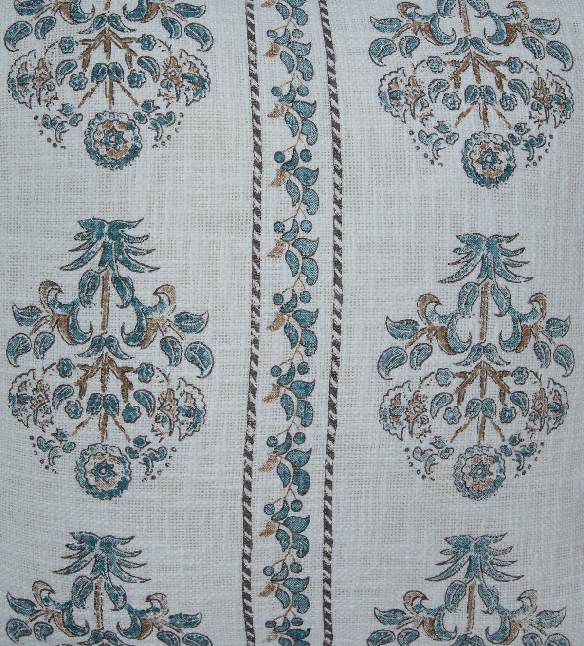 Close-up of white pillow fabric with blue and tan ornate floral medallions
