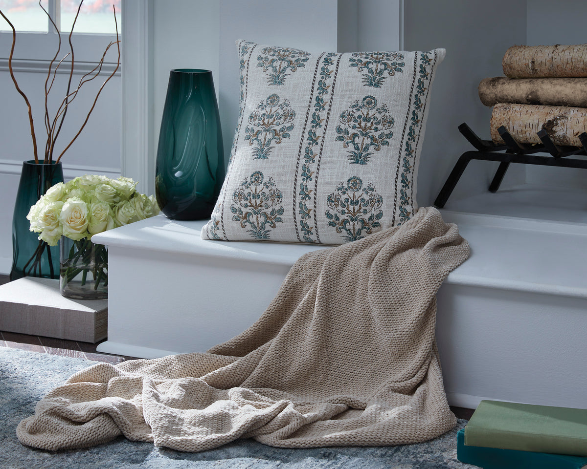 Ashley Paulmour pillow with white fabric and blue ornamental medallion pattern