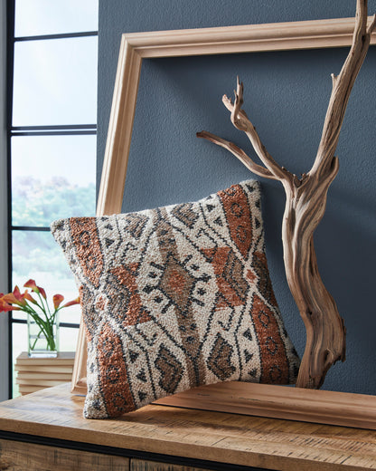 Geometric woven square pillow with brown, orange, and cream pattern