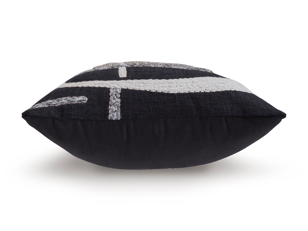 Black lumbar pillow with silver-and-white embroidered geometric motif across front