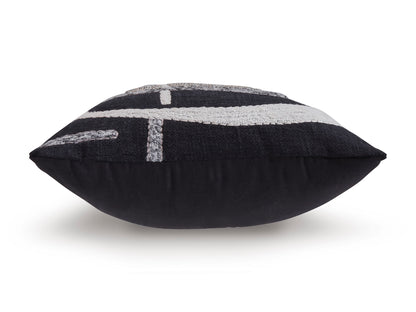 Black lumbar pillow with silver-and-white embroidered geometric motif across front