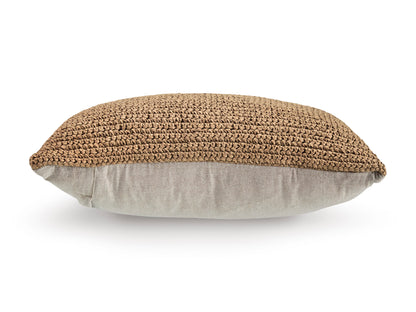 Round woven pillow with tan textured cover and light gray underside
