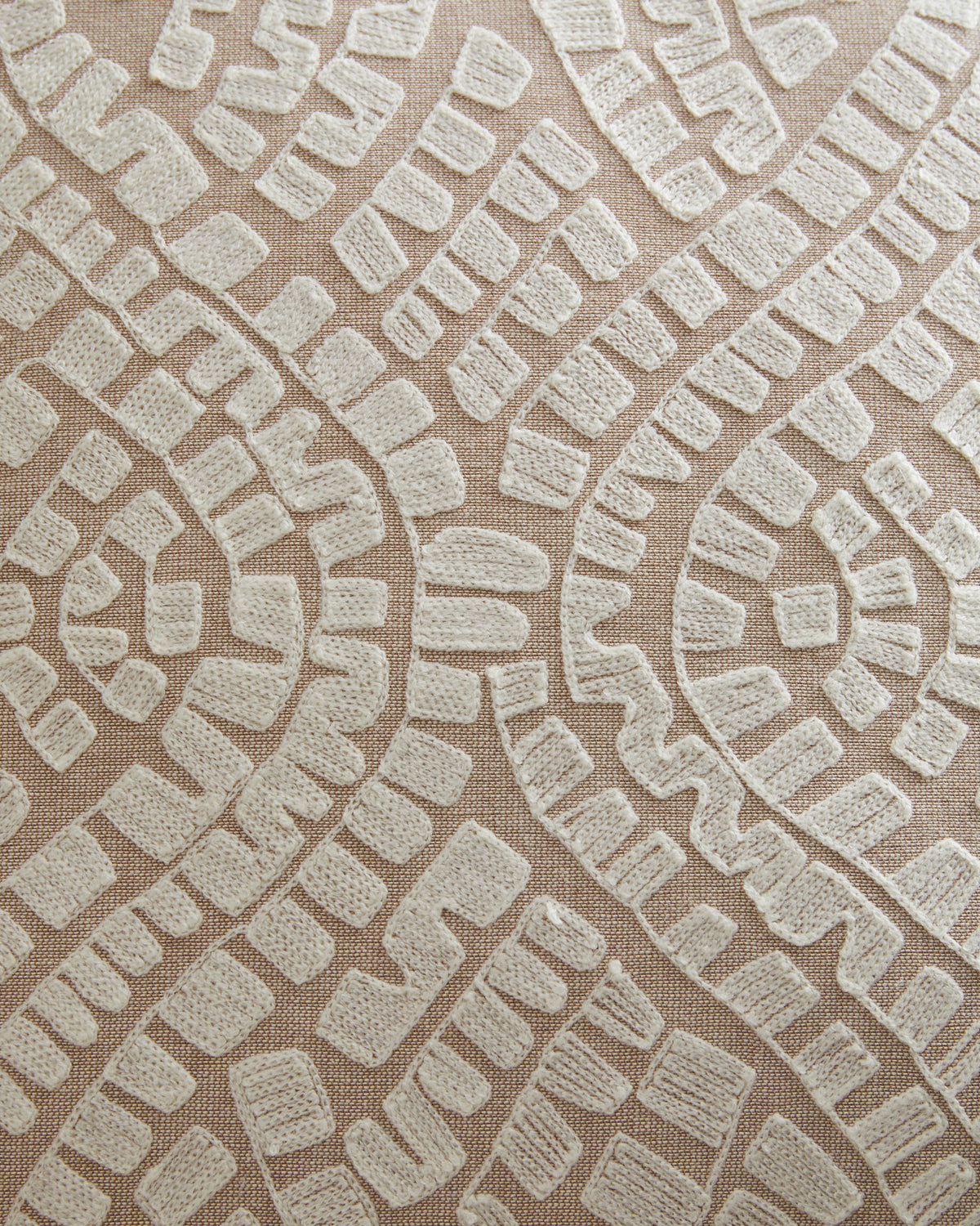 Close-up of beige and white textured geometric pillow fabric pattern