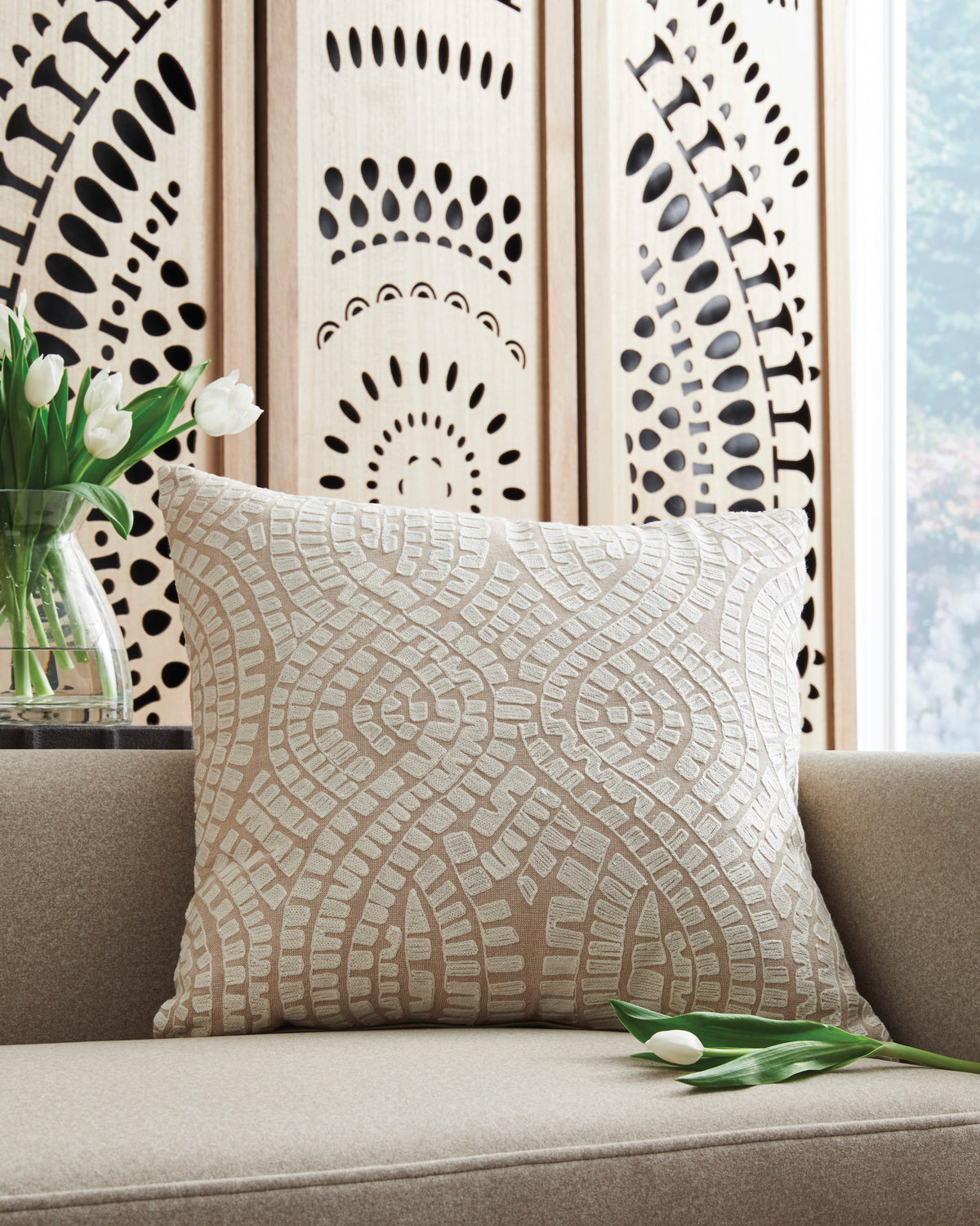 Decorative throw pillow with beige and white textured geometric pattern