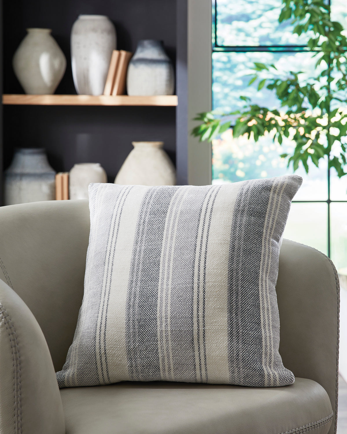 Light gray and white striped decorative pillow, woven fabric