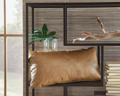 Suede-look rectangular pillow in caramel tan on chair frame