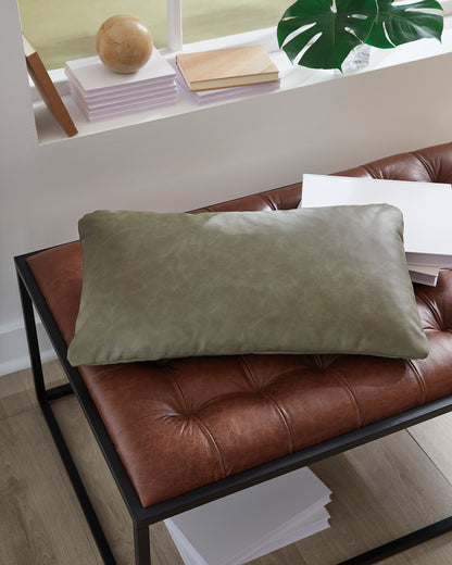 Rectangular decorative pillow, sage green faux leather look on a brown chair