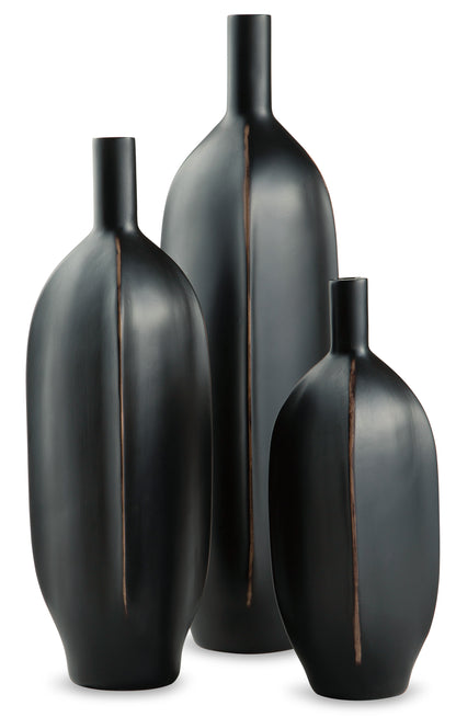 Set of black ceramic vases in varying heights with copper-toned accent seams.