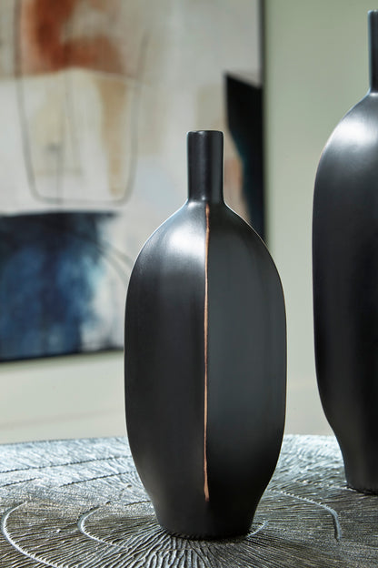 Black ceramic vase with tall neck and copper-toned vertical accent seam.