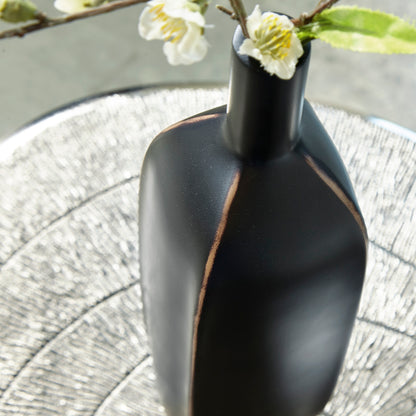 Matte black vase body with vertical copper seam line