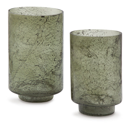 Set of 2 green speckled glass candle holders, rounded cylinders with open tops.