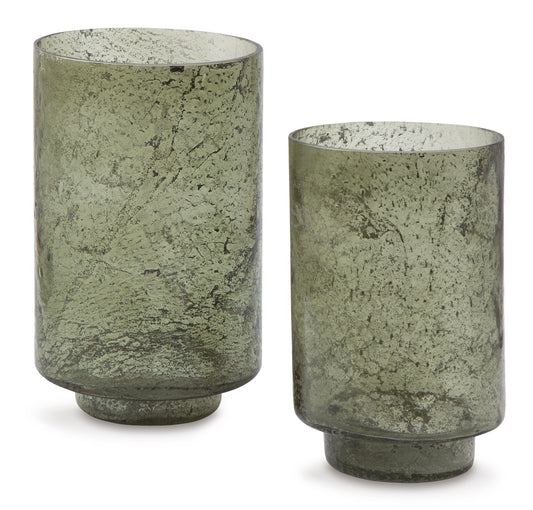 Set of 2 green speckled glass candle holders, rounded cylinders with open tops.