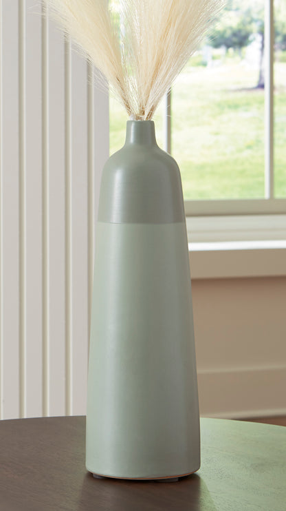 Tall matte ceramic vase with narrow neck and flared rim, with dried grass stems