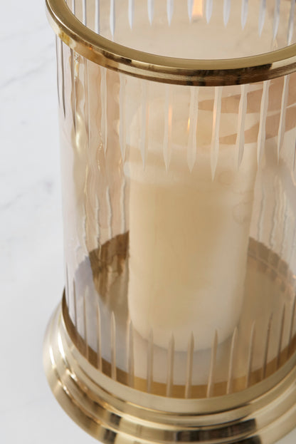 Close-up of gold-banded glass candle holder with clear ribbed sides