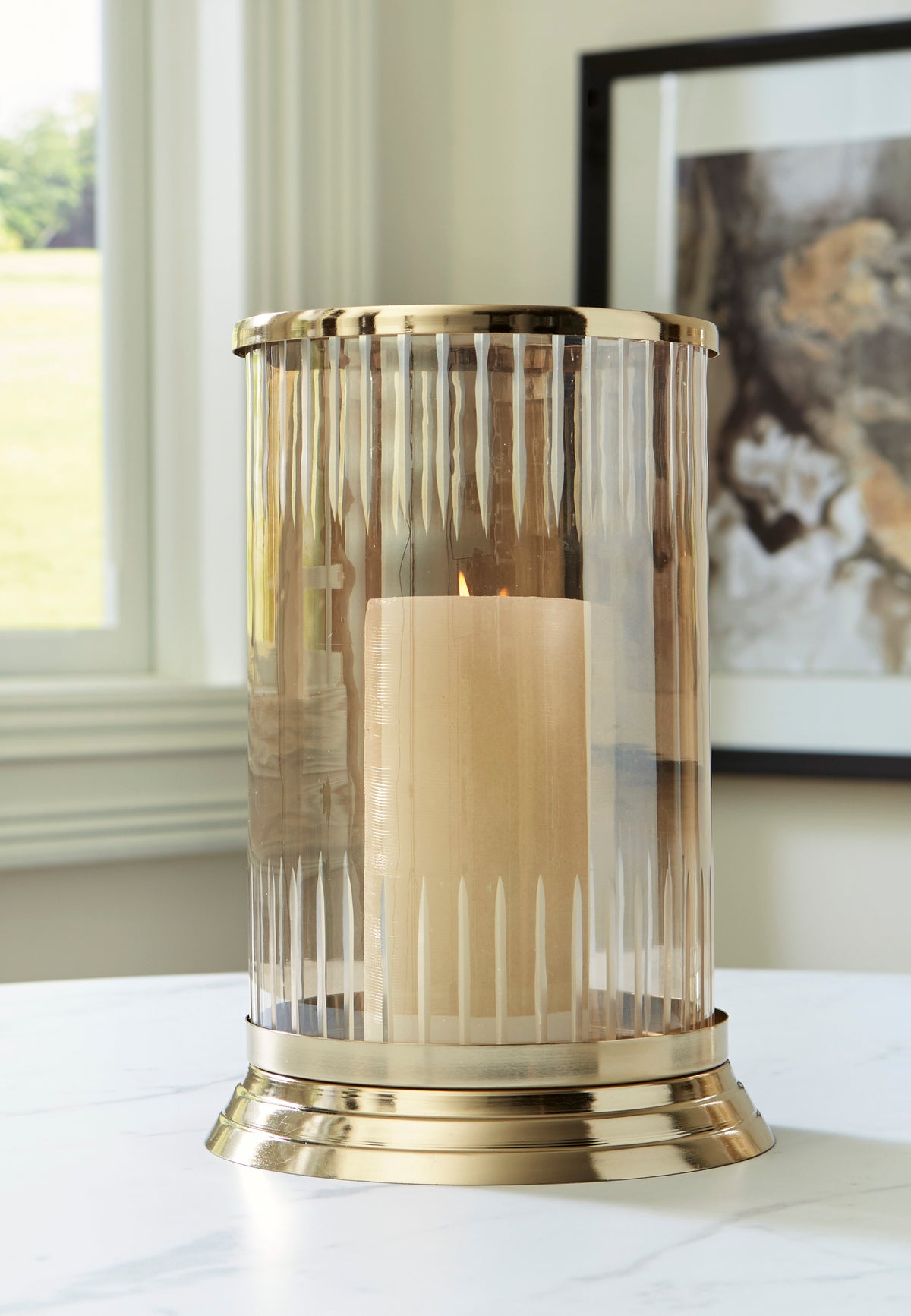 Gold-trim glass candle holder with ribbed clear sides and base