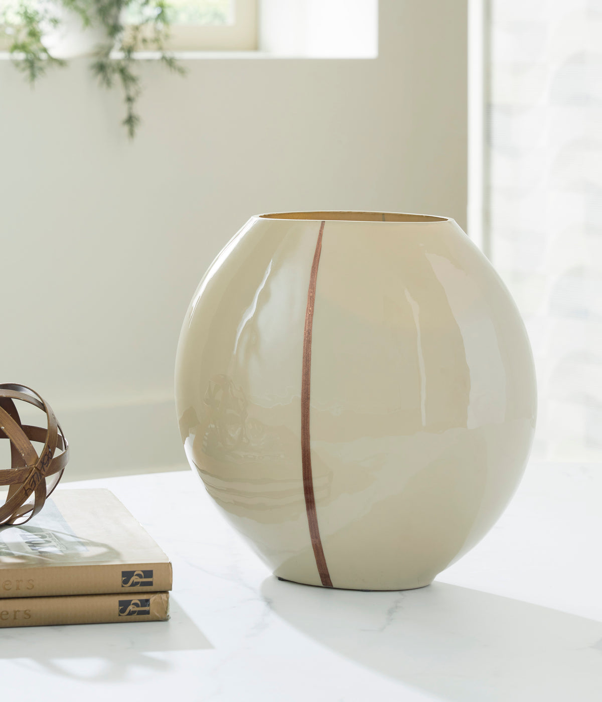 Ashley Sheabourne vase, round cream ceramic with vertical rust stripe and wide open rim.
