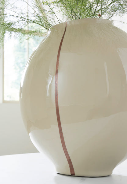 Ashley Sheabourne vase close-up, glossy cream ceramic with vertical rust stripe on front.