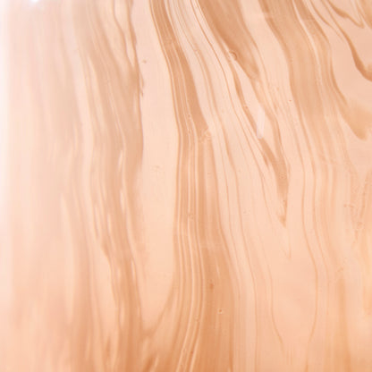 Peach glass vase body with vertical wavy striations