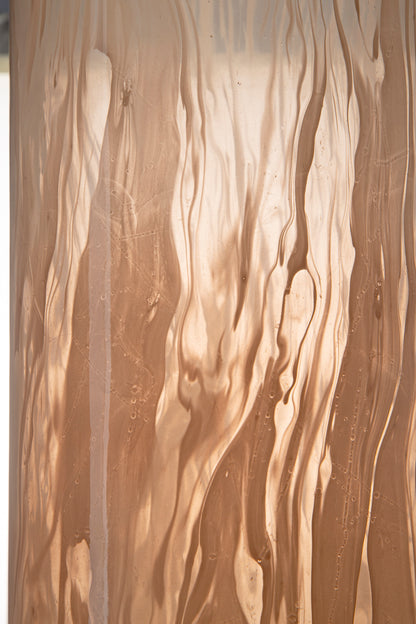 Amber glass vase with vertical wavy surface texture