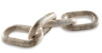 Interlocking chain-link sculpture with speckled light stone links, spaced loop view