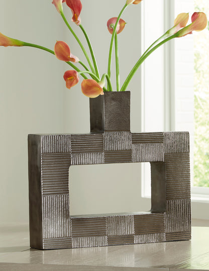 Decorative metal vase with geometric block pattern and open square cutout, dark gray